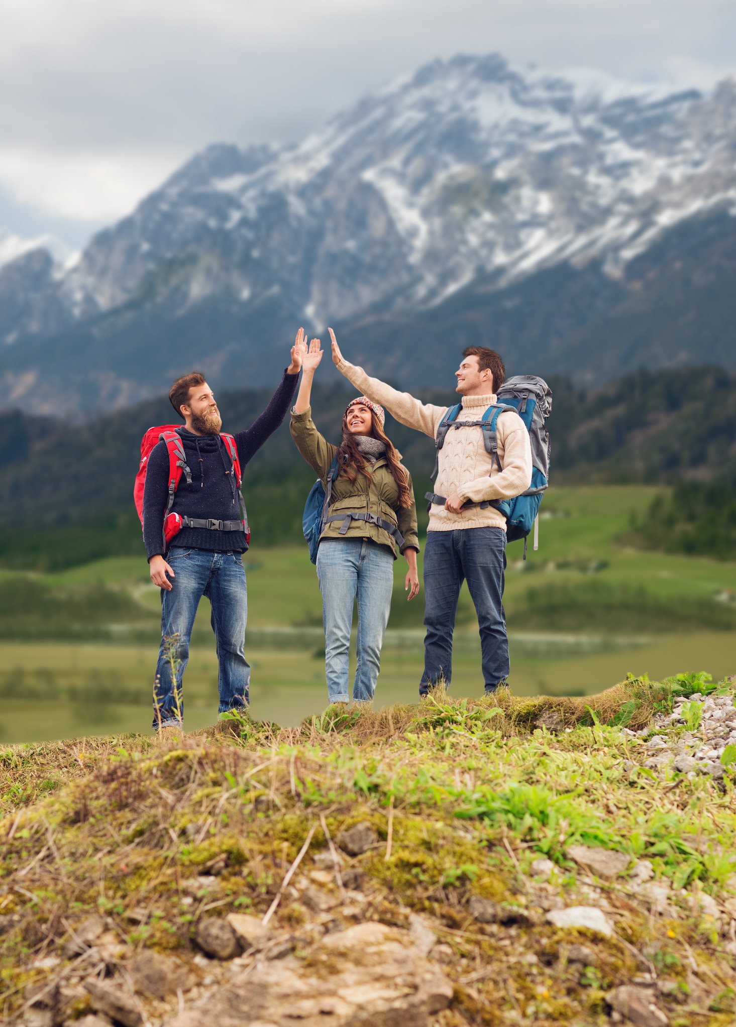 Travel to Play — Ski, Golf, Cycling, Hiking, Surf, Fishing & More Group of friends hiking with backpacks on an adventure trip